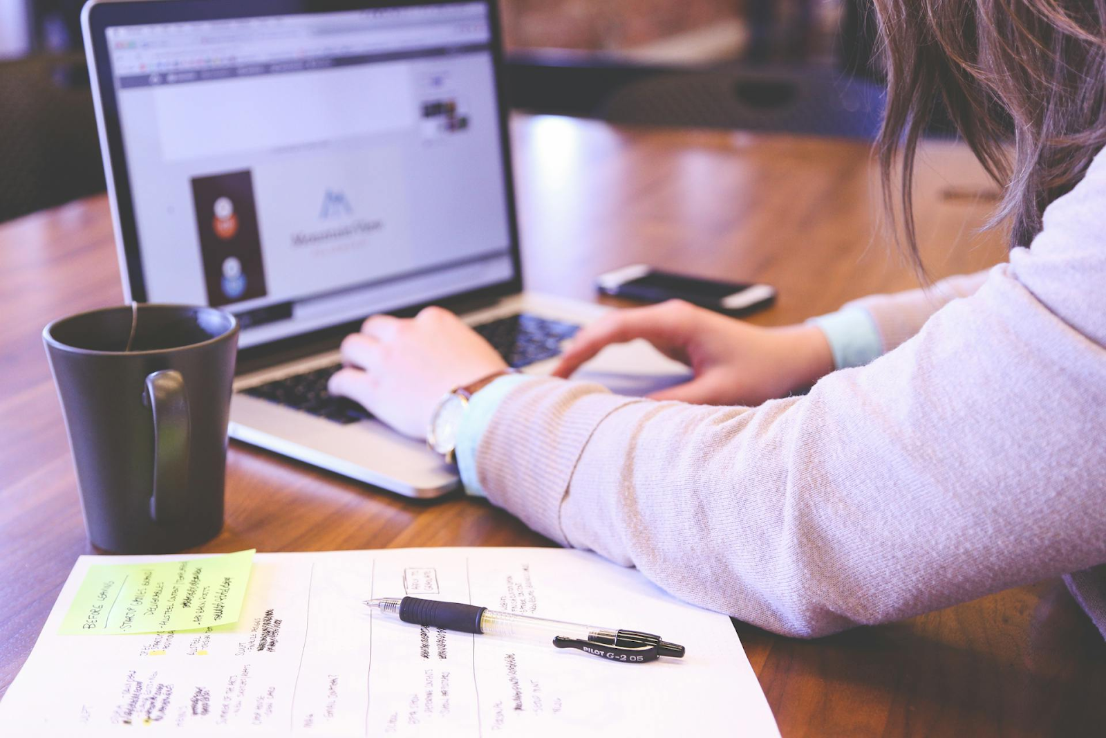 A woman working on a laptop